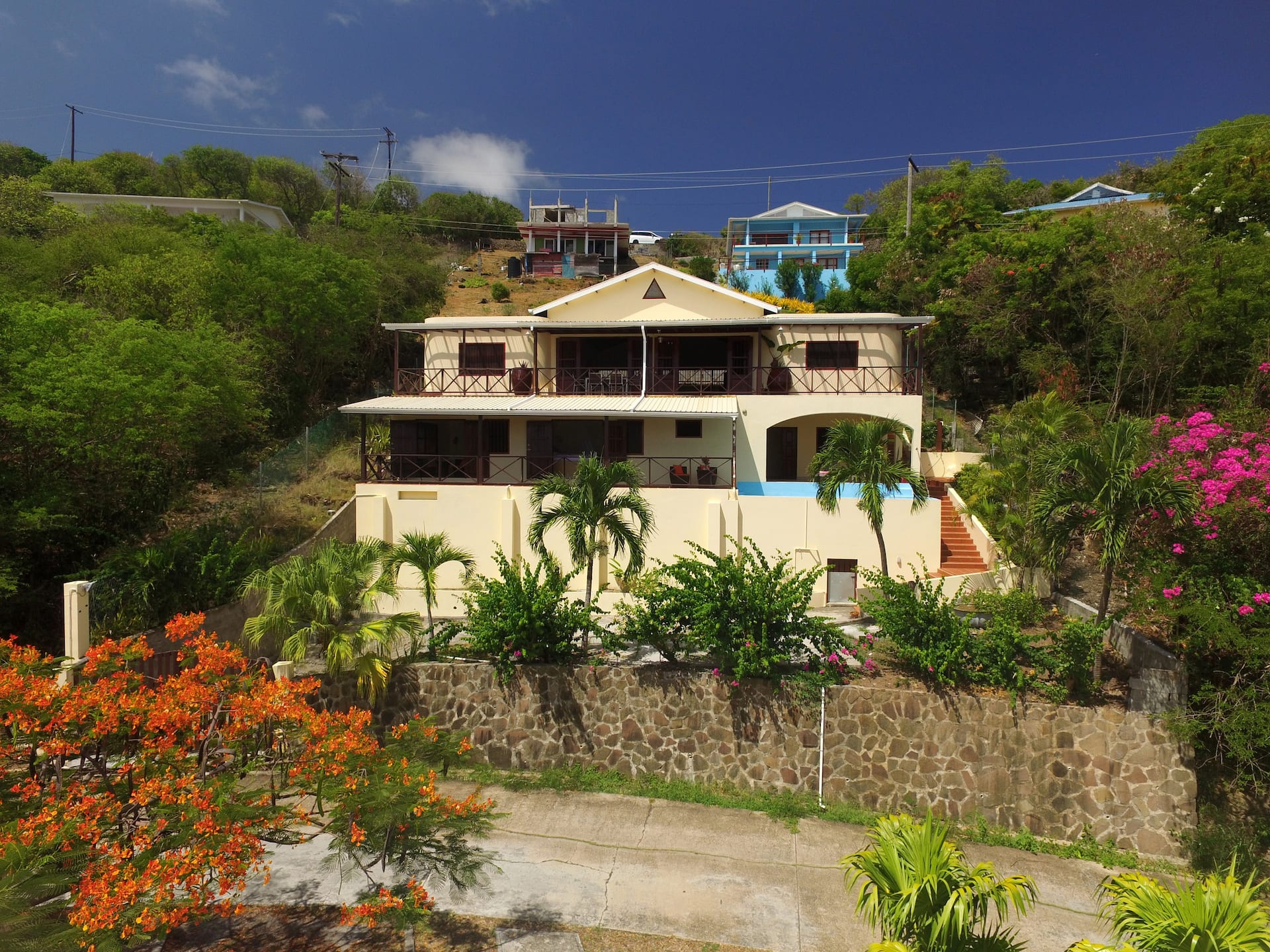 Villa Marisol exterior with tropical gardens and bougainvillea, Bequia