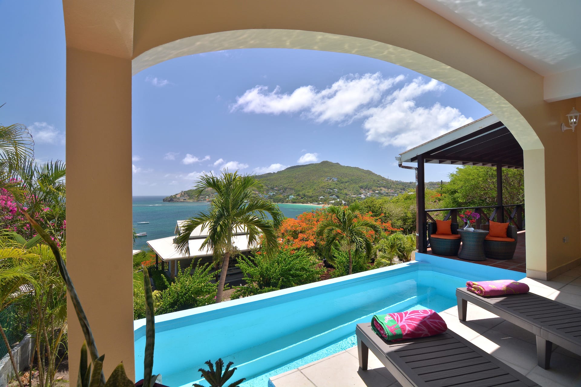 Villa Marisol private pool with arch framing the turquoise Friendship Bay, Bequia
